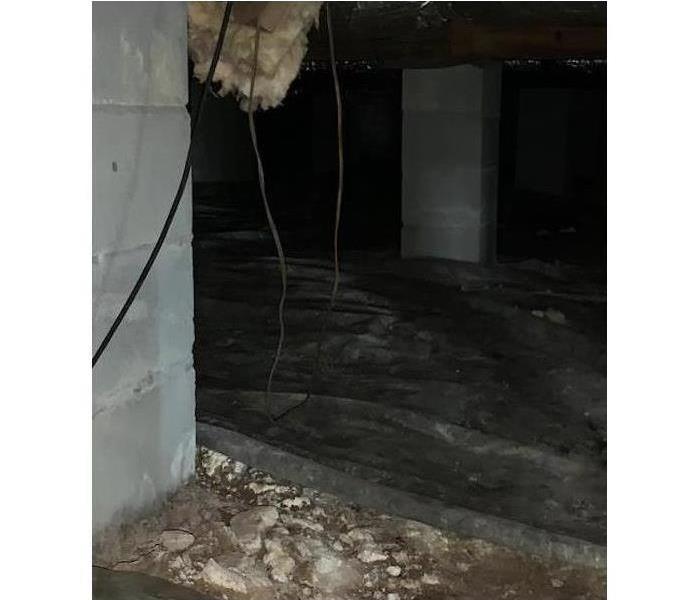 Dirty crawlspace under New Bern Home