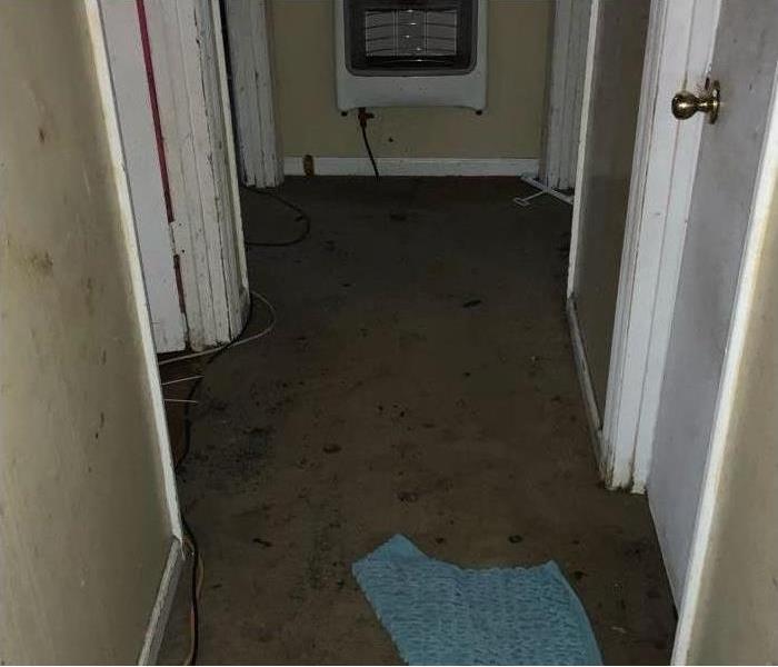 Image of hall floor damaged with soot and smoke after a grease fire