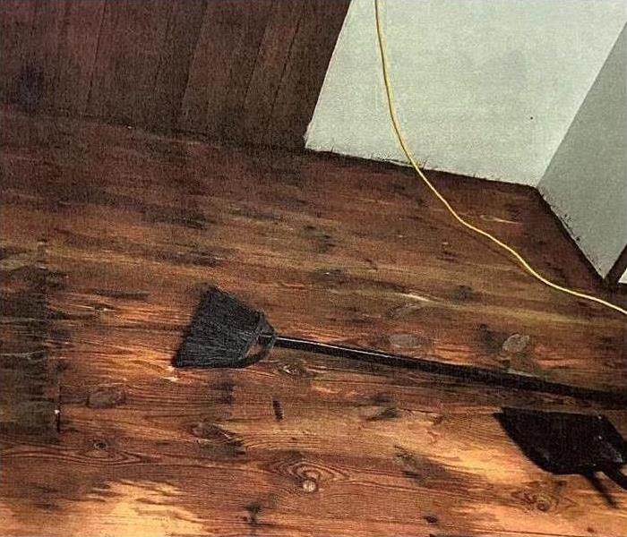 Image of kitchen flooring damaged after suffering water damage 